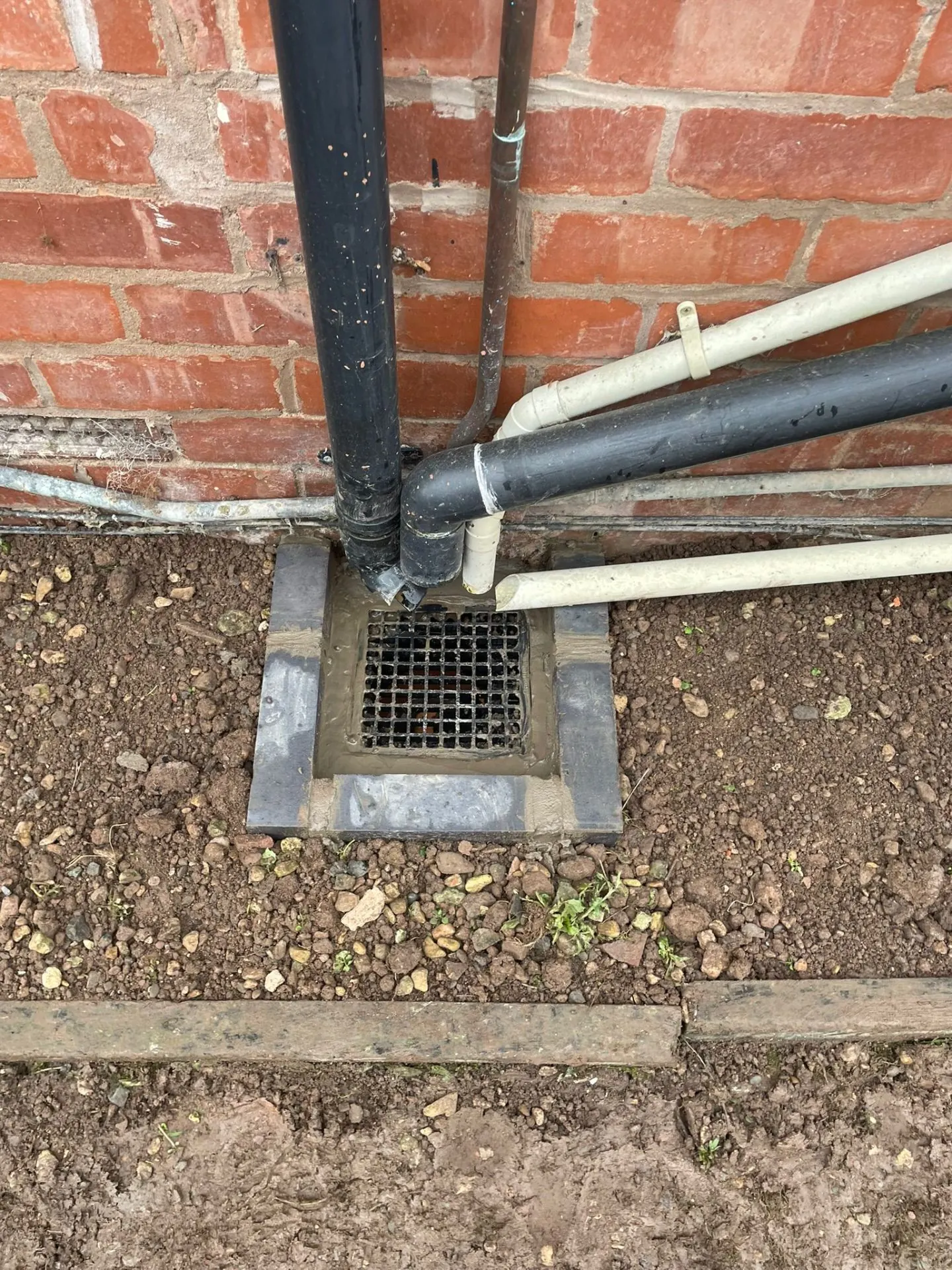 Tired gully → new drain & surround — after