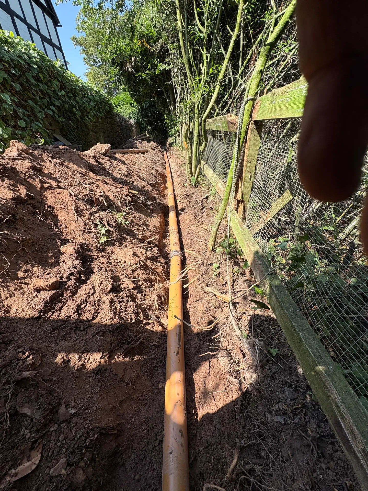 New drainage pipe run following a fence line